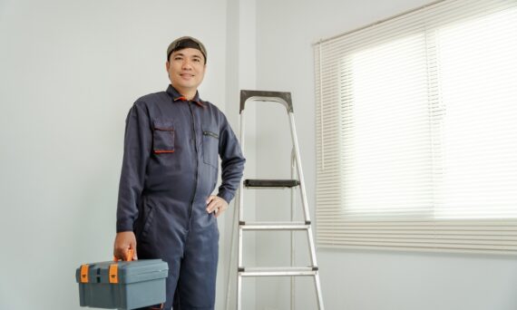 A,Professional,Installer,In,Uniform,With,His,Toolbox,,Modern,Blinds